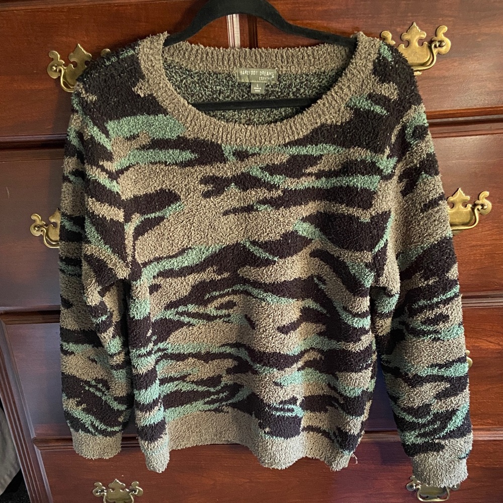 This is a generous crew/round neck, heavy sweater.